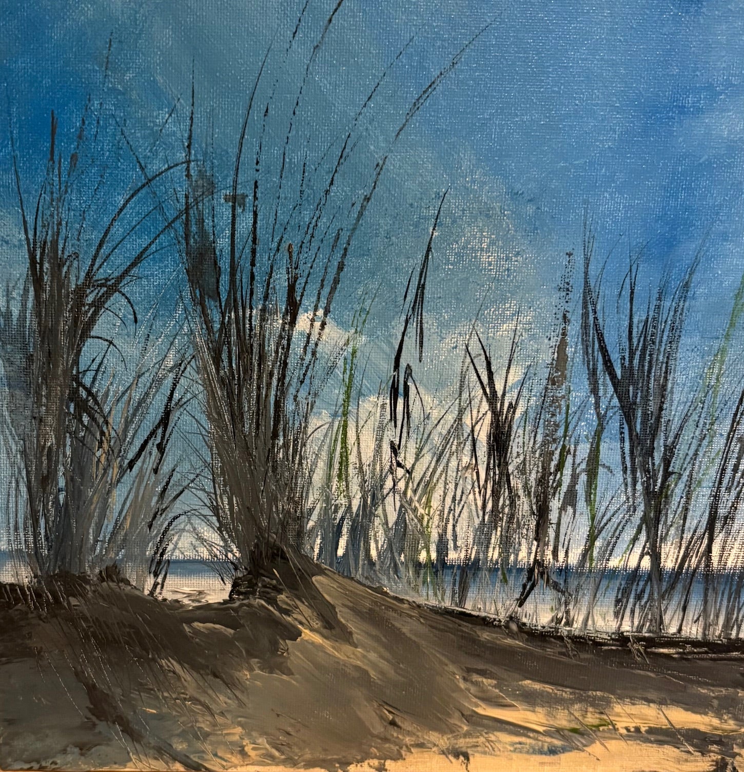 Artistic depiction of beach scene with sand, grass, and water under a blue sky. Dollymount beach painting 